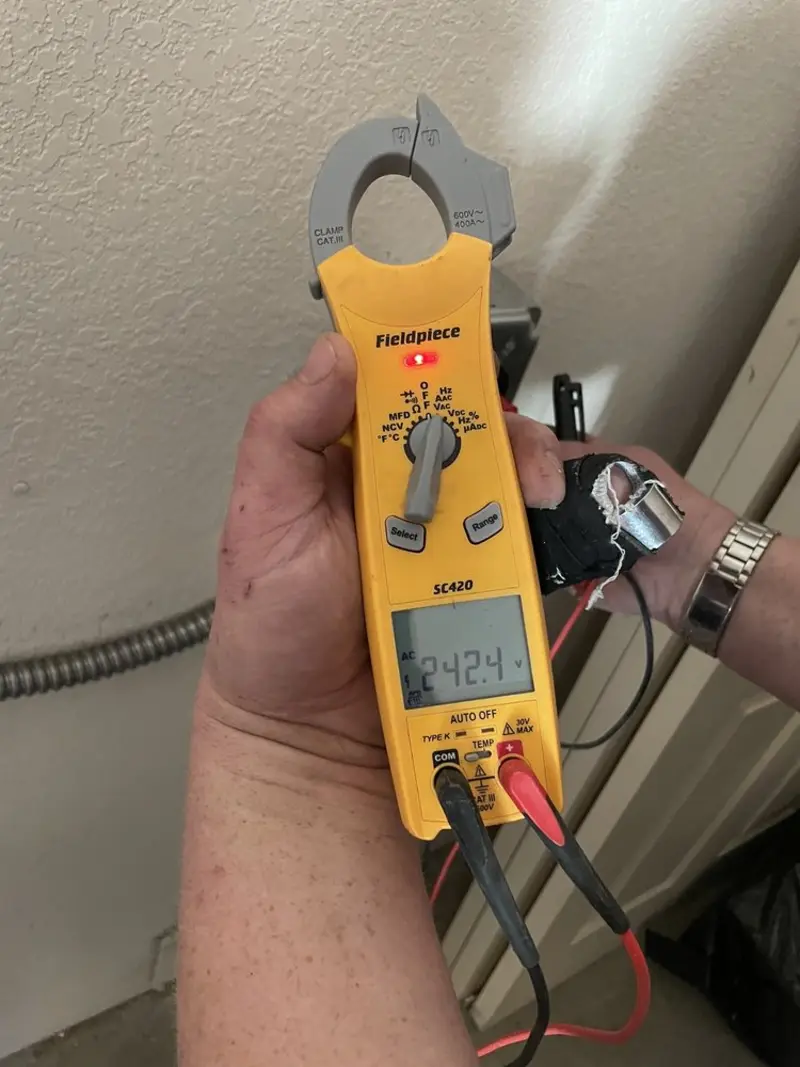 Voltage testing with clamp meter during Outlet Installation in Morris Plains